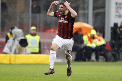 AC Milan's Patrick Cutrone celebrates after scoring his side's second goal during the Serie A soccer match between AC Milan and Chievo Verona at the San Siro stadium in Milan, Italy, Sunday, March 18, 2018. (AP Photo/Antonio Calanni)