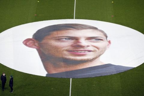 A giant canvas showing Argentinian player Emiliano Sala is pictured in La Beaujoire stadium before the French soccer League One match Nantes against Saint-Etienne, in Nantes, western France, Wednesday, Jan.30, 2019. Sala disappeared over the English Channel on Jan. 21, 2019 as it flew from France to Wales. Sala had just been signed by Premier League club Cardiff. (AP Photo/Thibault Camus)