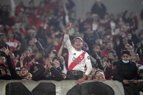 Fans of River Plate cheer before a Copa Libertadores round of sixteen, second leg soccer match against Velez Sarsfield at Monumental stadium in Buenos Aires, Argentina, Wednesday, July 6, 2022. (AP Photo/Natacha Pisarenko)