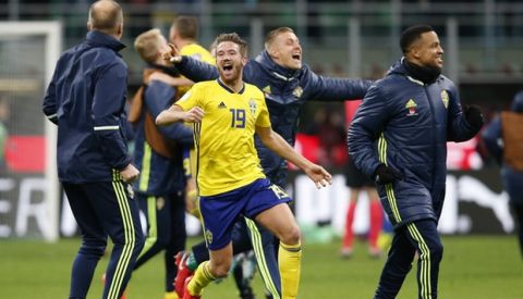 Sweden's players celebrate at the end of the World Cup qualifying play-off second leg soccer match between Italy and Sweden, at the Milan San Siro stadium, Italy, Monday, Nov. 13, 2017. Four-time champion Italy has failed to qualify for World Cup; Sweden advances with 1-0 aggregate win in playoff. (AP Photo/Antonio Calanni)