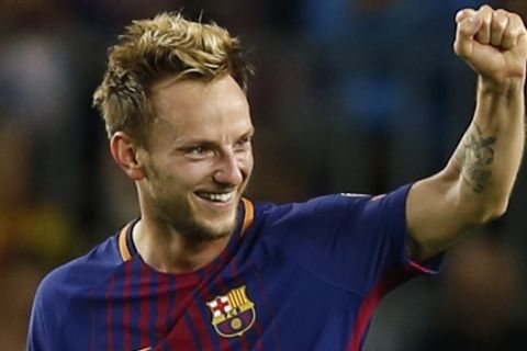 Barcelona's Ivan Rakitic celebrates after scoring his side's second goal during a Champions League group D soccer match between FC Barcelona and Juventus at the Camp Nou stadium in Barcelona, Spain, Tuesday, Sept. 12, 2017. (AP Photo/Francisco Seco)