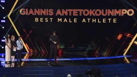 NBA player Giannis Antetokounmpo, of the Milwaukee Bucks, accepts the award for best male athlete at the ESPY Awards on Wednesday, July 10, 2019, at the Microsoft Theater in Los Angeles. (Photo by Chris Pizzello/Invision/AP)
