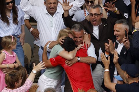 Serbia's Novak Djokovic hugs his family as he celebrates winning the men's singles final match of the French Open tennis tournament against Norway's Casper Ruud in three sets, 7-6, (7-1), 6-3, 7-5, at the Roland Garros stadium in Paris, Sunday, June 11, 2023. Djokovic won his record 23rd Grand Slam singles title, breaking a tie with Rafael Nadal for the most by a man. (AP Photo/Jean-Francois Badias)