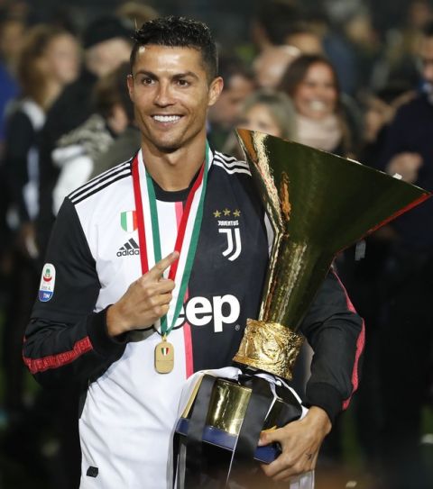 Juventus' Cristiano Ronaldo celebrates after winning the Serie A soccer title trophy, at the Allianz Stadium, in Turin, Italy, Sunday, May 19, 2019. (AP Photo/Antonio Calanni)