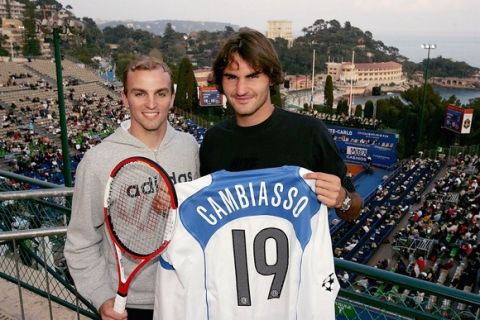 MONACO - APRIL 14:  Roger Federer (R) of Switzerland poses with Inter Milans Esteban Cambiasso after his third round match during the ATP Masters Series on April 14, 2005 at the Monte Carlo Country Club in Monte Carlo, Monaco.  (Photo by Clive Brunskill/Getty Images)