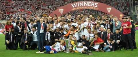 Sevilla FC players celebrate with cup after their UEFA Europa League final against SL Benfica
