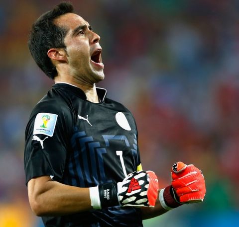 CUIABA, BRAZIL - JUNE 13: Claudio Bravo of Chile reacts after defeating Australia 3-1 during the 2014 FIFA World Cup Brazil Group B match between Chile and Australia at Arena Pantanal on June 13, 2014 in Cuiaba, Brazil.  (Photo by Matthew Lewis/Getty Images)
