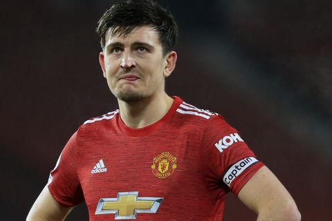 Manchester United's Harry Maguire reacts during the English Premier League soccer match between Manchester United and Southampton, at the Old Trafford stadium in Manchester, England, Tuesday, Feb. 2, 2021. (Lindsey Parnaby/Pool via AP)