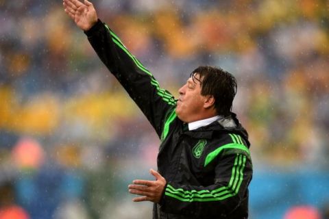 NATAL, BRAZIL - JUNE 13:  Miguel Herrera of Mexico reacts during the 2014 FIFA World Cup Brazil Group A match between Mexico and Cameroon at Estadio das Dunas on June 13, 2014 in Natal, Brazil.  (Photo by Shaun Botterill - FIFA/FIFA via Getty Images)