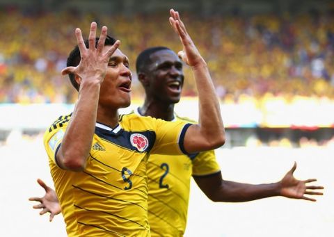 BELO HORIZONTE, BRAZIL - JUNE 14:  Teofilo Gutierrez of Colombia (L) celebrates scoring his teams second goal with Cristian Zapata during the 2014 FIFA World Cup Brazil Group C match between Colombia and Greece at Estadio Mineirao on June 14, 2014 in Belo Horizonte, Brazil.  (Photo by Paul Gilham/Getty Images)