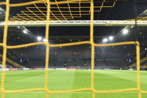 The empty pitch of the Signal Iduna Park in Dortmund, Germany, Tuesday, April 11. The first leg of the Champions League quarter final soccer match between Borussia Dortmund and AS Monaco had been cancelled to an explosion. (AP Photo/Federico Gambarini/dpa via AP)