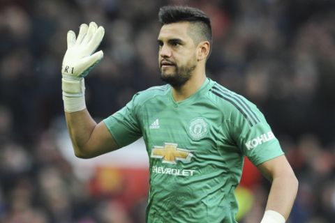 Manchester United's Sergio Romero walk on the pitch prior the English FA Cup third round soccer match between Manchester United and Reading at Old Trafford in Manchester, England, Saturday, Jan. 5, 2019. (AP Photo/Rui Vieira)