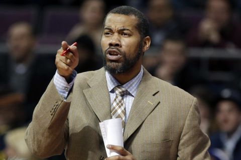 FILE - In this Feb. 24, 2014, file photo, Detroit Pistons assistant coach Rasheed Wallace directs players  during the second half of an NBA basketball game against the Golden State Warriors in Auburn Hills, Mich. Memphis coach Penny Hardaway has added 16-year NBA veteran Rasheed Wallace as an assistant coach on a staff that also features former NBA coach Larry Brown.  (AP Photo/Carlos Osorio, File)