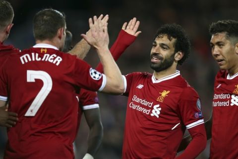 Liverpool's Mohamed Salah, 2nd right, celebrates with his teammates their side's third goal during the Champions League semifinal, first leg, soccer match between Liverpool and AS Roma at Anfield Stadium, Liverpool, England, Tuesday, April 24, 2018. (AP Photo/Dave Thompson)