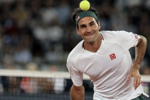 Roger Federer in action during the exhibition tennis match against Rafael Nadal held at the Cape Town Stadium in Cape Town, South Africa, Friday Feb. 7, 2020. (AP Photo/Halden Krog)