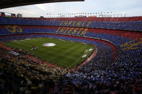 FC Barcelona's supporters pay tribute to Barcelona's Andres Iniesta prior of the Spanish La Liga soccer match between FC Barcelona and Real Sociedad at the Camp Nou stadium in Barcelona, Spain, Sunday, May 20, 2018. Iniesta announced last month he would leave Barcelona after 16 seasons. (AP Photo/Manu Fernandez)
