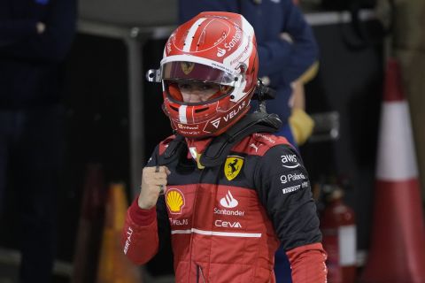 Ferrari driver Charles Leclerc of Monaco celebrates pole position after qualifying session for the Formula One Bahrain Grand Prix it in Sakhir, Bahrain, Saturday, March 19, 2022. (AP Photo/Hassan Ammar)