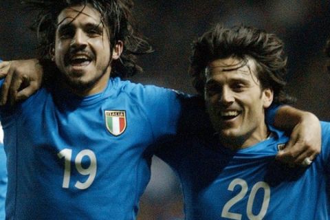 Italy's Vincenzo Montella (20) celebrates with Gennaro Ivan Gattuso (19) after scoring against England during their friendly match at Elland Rd., Leeds Wednesday March 27, 2002. Italy won 2-1.  (AP Photo/Paul Barker)