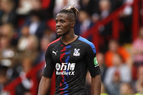 Crystal Palace's Wilfried Zaha during the English Premier League soccer match between Sheffield United and Crystal Palace at Bramall Lane in Sheffield, England, Sunday, Aug. 18, 2019. (AP Photo/Rui Vieira)