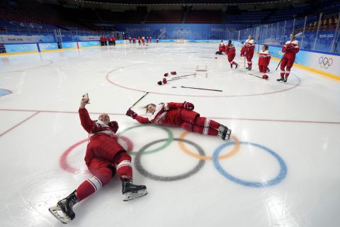 Players of Denmark's women's ice hockey team pose for photo at the 2022 Winter Olympics, Tuesday, Feb. 1, 2022, in Beijing. (AP Photo/Petr David Josek)