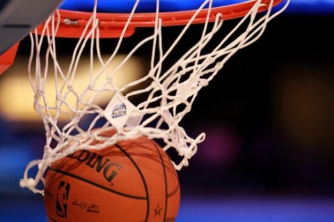 ORLANDO, FL - FEBRUARY 26:  A detail of an official Spalding basketball going through the net with an offical logo of the 2012 Orlando NBA All-Star Game during the 2012 NBA All-Star Game at the Amway Center on February 26, 2012 in Orlando, Florida.  NOTE TO USER: User expressly acknowledges and agrees that, by downloading and or using this photograph, User is consenting to the terms and conditions of the Getty Images License Agreement.  (Photo by Ronald Martinez/Getty Images)