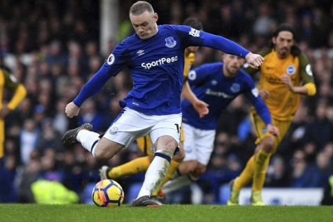 Everton's Wayne Rooney takes and misses a penalty against Brighton & Hove Albion during their English Premier League soccer match at Goodison Park in Liverpool, England, Saturday March 10, 2018. (Anthony Devlin/PA via AP)