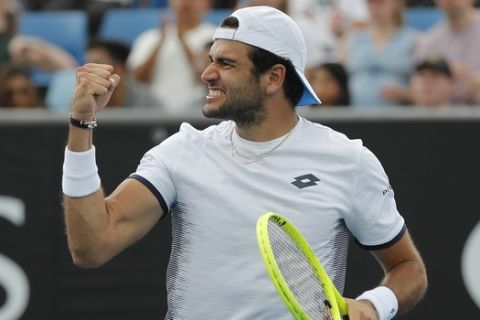 Italy's Matteo Berrettini reacts after winning a point against Tennys Sandgren of the U.S. during their second round singles match at the Australian Open tennis championship in Melbourne, Australia, Wednesday, Jan. 22, 2020. (AP Photo/Andy Wong)