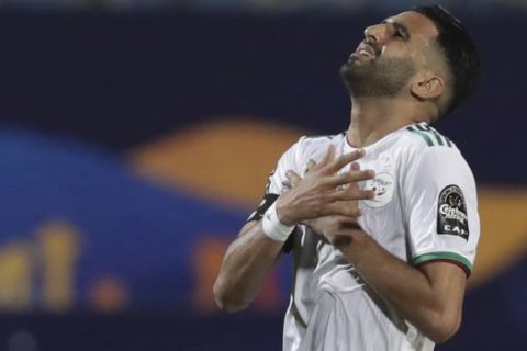 Algeria's Riyad Mahrez reacts after a missed scoring opportunity during the African Cup of Nations group C soccer match between Algeria and Kenya at 30 June Stadium in Cairo, Egypt, Sunday, June 23, 2019. (AP Photo/Hassan Ammar)