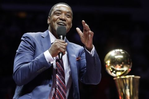 Former Detroit Pistons guard Isiah Thomas waves to the crowd during halftime of an NBA basketball game between the Detroit Pistons and the Los Angeles Lakers, Wednesday, Feb. 8, 2017, in Auburn Hills, Mich. Thomas was honored at halftime as part of the team's ongoing celebration of its years at The Palace. (AP Photo/Carlos Osorio)
