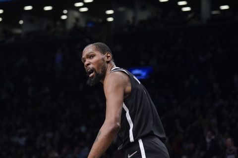 Brooklyn Nets' Kevin Durant reacts during the second half of the NBA basketball game against the New York Knicks at the Barclays Center, Sunday, Mar. 13, 2022, in New York. The Nets defeated the Knicks 110-107. (AP Photo/Seth Wenig)