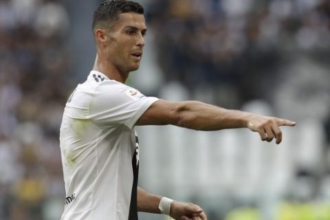 Juventus' Cristiano Ronaldo gestures to his teammates during the Serie A soccer match between Juventus and Lazio at the Allianz Stadium in Turin, Italy, Saturday, Aug. 25, 2018. (AP Photo/Luca Bruno)