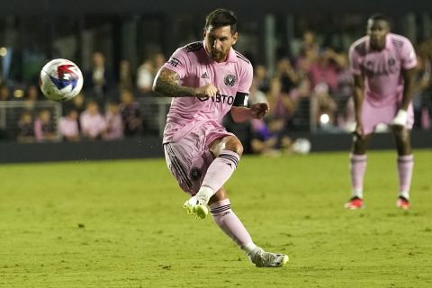 Inter Miami forward Lionel Messi (10) kicks the ball on a free kick during the first half of a Leagues Cup soccer match against Orlando City, Wednesday, Aug. 2, 2023, in Fort Lauderdale, Fla. (AP Photo/Lynne Sladky)