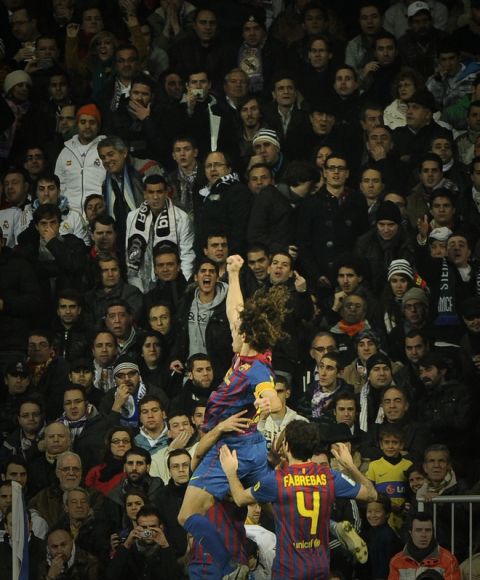 Barcelona's captain Carles Puyol celebrate after scoring during the Spanish Cup "El clasico" football match Real Madrid vs Barcelona at the Santiago Barnabeu stadium in Madrid on January 18, 2012.   AFP PHOTO/ PEDRO ARMESTRE (Photo credit should read PEDRO ARMESTRE/AFP/Getty Images)