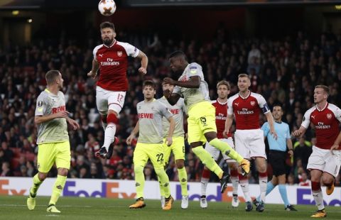 Arsenal's Olivier Giroud, second from left, jumps to head the ball during the Europa League group H soccer match between Arsenal and FC Cologne at the Emirates stadium in London, England, Thursday, Sept. 14, 2017 . (AP Photo/Kirsty Wigglesworth)