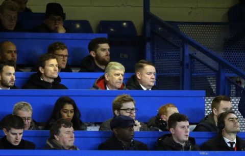 Arsenal manager Arsene Wenger, center, looks out from the press box during the English League Cup semifinal, first leg, soccer match between Chelsea and Arsenal at Stamford Bridge stadium in London, Wednesday, Jan. 10, 2018. (AP Photo/Alastair Grant)