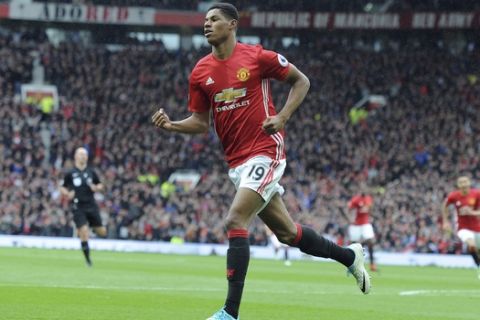 Manchester United's Marcus Rashford celebrates after scoring his side's first goal during the English Premier League soccer match between Manchester United and Chelsea at Old Trafford stadium in Manchester, Sunday, April 16, 2017.(AP Photo/ Rui Vieira)