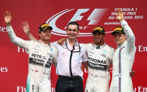 MONTREAL, QC - JUNE 07:  Race Winner Lewis Hamilton of Great Britain and Mercedes GP celebrates on the podium with second placed Nico Rosberg (L) of Germany and Mercedes GP and third placed Valtteri Bottas (R) of Finland and Williams during the Canadian Formula One Grand Prix at Circuit Gilles Villeneuve on June 7, 2015 in Montreal, Canada.  (Photo by Mark Thompson/Getty Images)