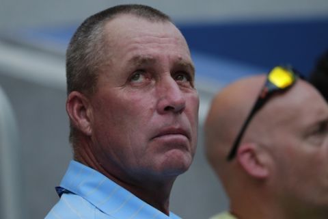 Tennis great Ivan Lendl, lower left, watches as Alexander Zverev, of Germany, plays Peter Polansky, of Canada, during the first round of the U.S. Open tennis tournament, Tuesday, Aug. 28, 2018, in New York. (AP Photo/Andres Kudacki)