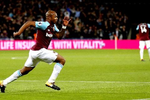 West Ham's Andre Ayew celebrates after scoring his side's second goal during the English Premier League soccer match between West Ham United and Huddersfield Town at London Stadium in London, Monday, Sept. 11, 2017.(AP Photo/Frank Augstein)