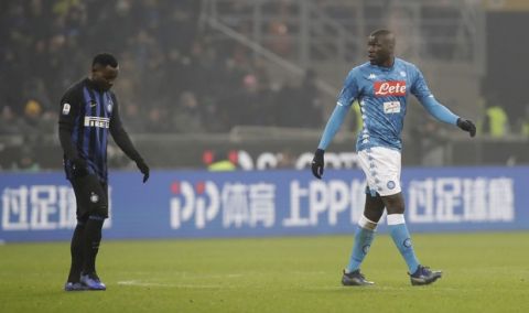 In this image taken on Wednesday, Dec.26, Napoli's Kalidou Koulibaly, right, leaves the pitch after receiving a red card from the referee 2018 during a Serie A soccer match between Inter Milan and Napoli, at the San Siro stadium in Milan, Italy. At left is Inter Milan's Kwadwo Asamoah. Cristiano Ronaldo has come to the defense of Kalidou Koulibaly after the Napoli defender was the target of racist chants during a match at Inter Milan. Next to a photo of him being marked by Koulibaly during a match earlier this season, Ronaldo writes on Instagram, "In the world and in football there always needs to be education and respect. No to racism and to any sort of insult and discrimination!!!". (AP Photo/Luca Bruno, File)
