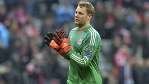 Bayern goalkeeper Manuel Neuer waves his fans after winning the Champions League group F soccer match between FC Bayern Munich and Olympiakos in Munich, Germany, Tuesday, Nov. 24, 2015. (AP Photo/Kerstin Joensson)