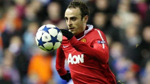 Manchester United's Dimitar Berbatov controls the ball during their Champions League Group C soccer match against Rangers at Ibrox, Glasgow, Scotland, Wednesday Nov. 24, 2010.(AP Photo/Scott Heppell)