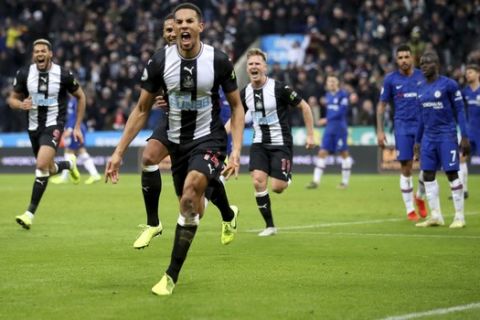 Newcastle United's Isaac Hayden, centre, celebrates scoring his side's first goal of the game during their English Premier League soccer match against Chelsea at St James' Park, Newcastle, England, Saturday, Jan. 18, 2020. (Owen Humphreys/PA via AP)