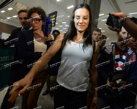 2912843 08/15/2016 Two-time Olympic champion Yelena Isinbayeva answers questions from journalists at the airport in Rio de Janeiro. Alexey Kudenko/Sputnik