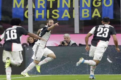 Juventus' Gonzalo Higuain, centre, celebrates after scoring his side's second goal during a Serie A soccer match between Inter Milan and Juventus, at the San Siro stadium in Milan, Italy, Sunday, Oct. 6, 2019. (AP Photo/Luca Bruno)