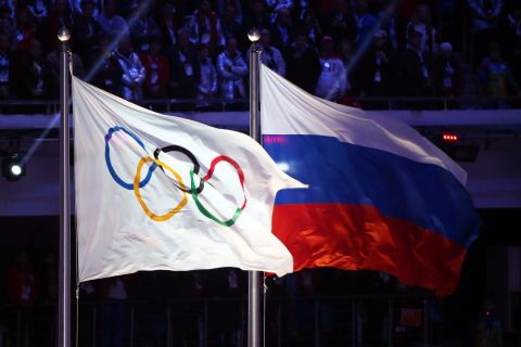 epa05371959 (FILE) A file picture dated 23 February 2014 of the Olympic flag (L) and the Russian flag (R) during the Closing Ceremony of the Sochi 2014 Olympic Games in the Fisht Olympic Stadium in Sochi, Russia. The International Association of Athletics Federations (IAAF) meets on 17 June 2016 in Vienna, Austria, to decide whether Russian athletes will compete in the Rio 2016 Olympics. EPA/HANNIBAL HANSCHKE *** Local Caption *** 52379149
