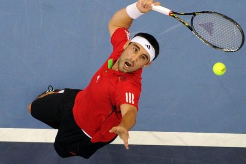 Marcos Baghdatis of Cyprus serves against Janko Tipsarevic of Serbia during their men's singles final at the ATP Malaysia Open tennis tournament in Kuala Lumpur on October 2, 2011.    AFP PHOTO / Saeed KHAN (Photo credit should read SAEED KHAN/AFP/Getty Images)
