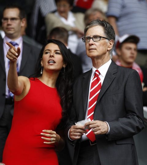 Liverpool owner John W Henry, right, stands alongside his wife Linda Pizzuti ahead of his team's English Premier League soccer match against Sunderland at Anfield Stadium, Liverpool, England, Saturday Aug. 13, 2011. (AP Photo/Jon Super)   NO INTERNET/MOBILE USAGE WITHOUT FOOTBALL ASSOCIATION PREMIER LEAGUE(FAPL)LICENCE. EMAIL info@football-dataco.com FOR DETAILS. 