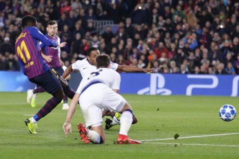 Barcelona forward Ousmane Dembele, left, scores his side's first goal during the Champions League group B soccer match between FC Barcelona and Tottenham Hotspur, at the Camp Nou stadium, in Barcelona, Spain, Tuesday, Dec. 11, 2018.(AP Photo/Manu Fernandez)