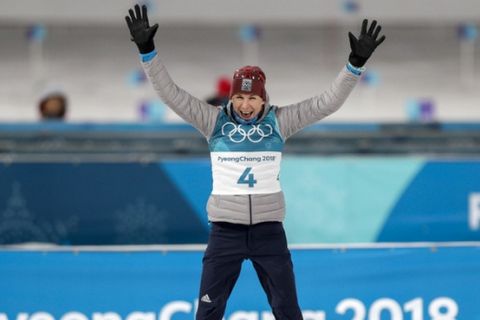Anastasiya Kuzmina, of Slovakia, celebrates her gold medal during the venue ceremony after the women's 12.5-kilometer mass start biathlon at the 2018 Winter Olympics in Pyeongchang, South Korea, Saturday, Feb. 17, 2018. (AP Photo/Andrew Medichini)